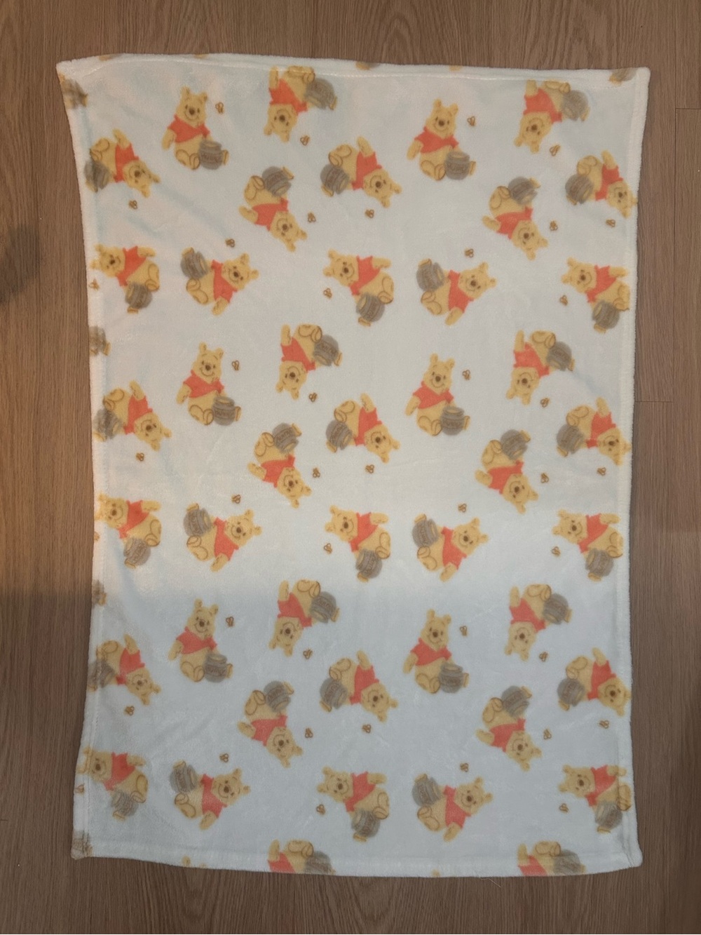 Disney Plush Blanket in White with Yellow and Red Winnie the Pooh Print